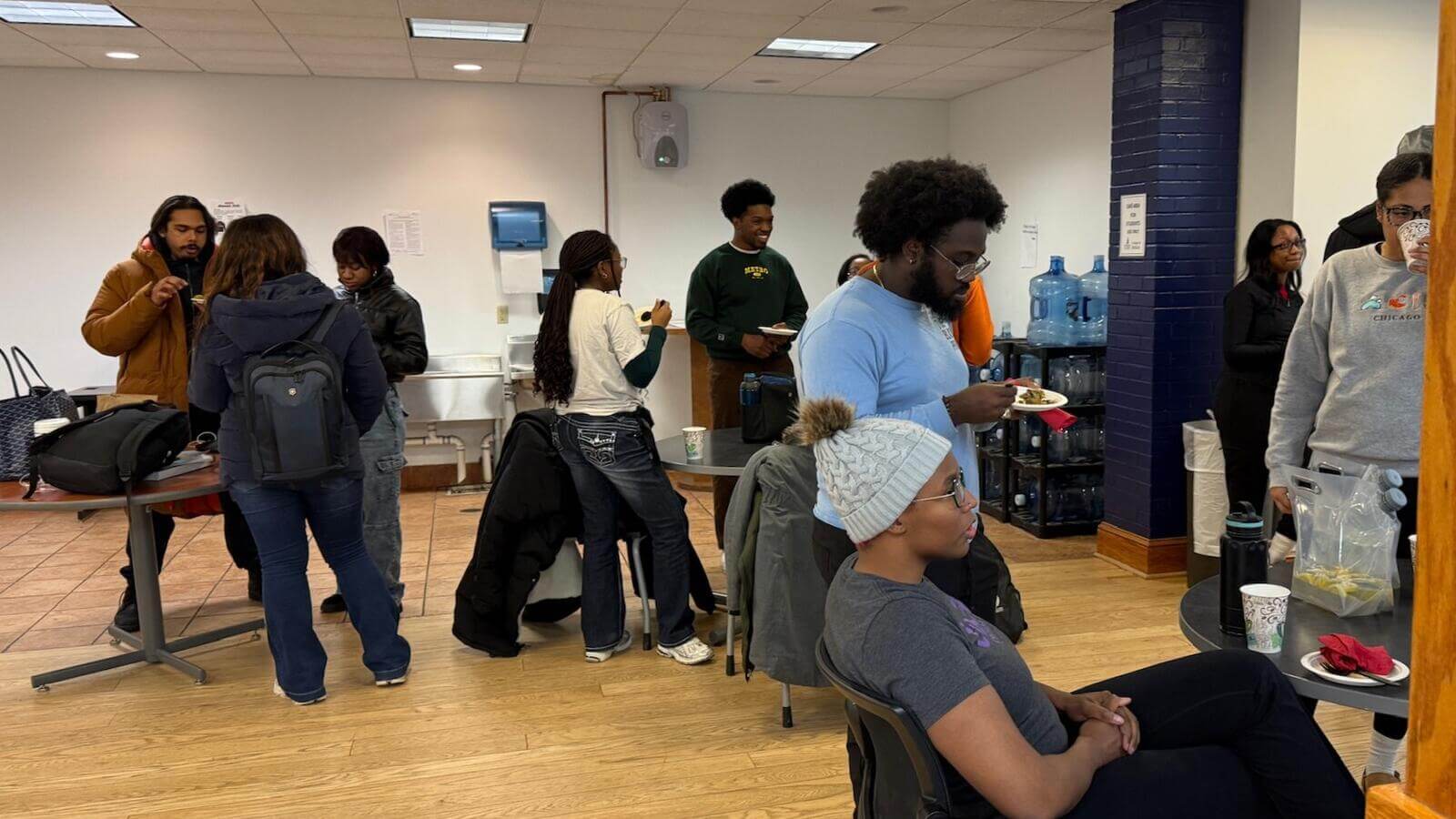 People gathered eating and conversing