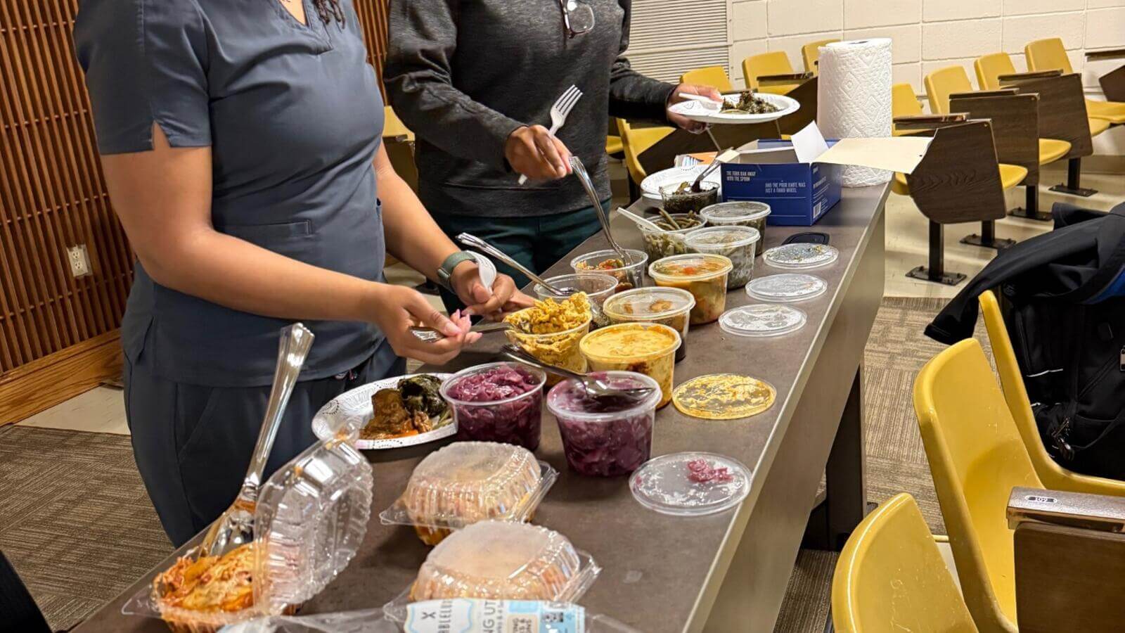students making plates from a food spread